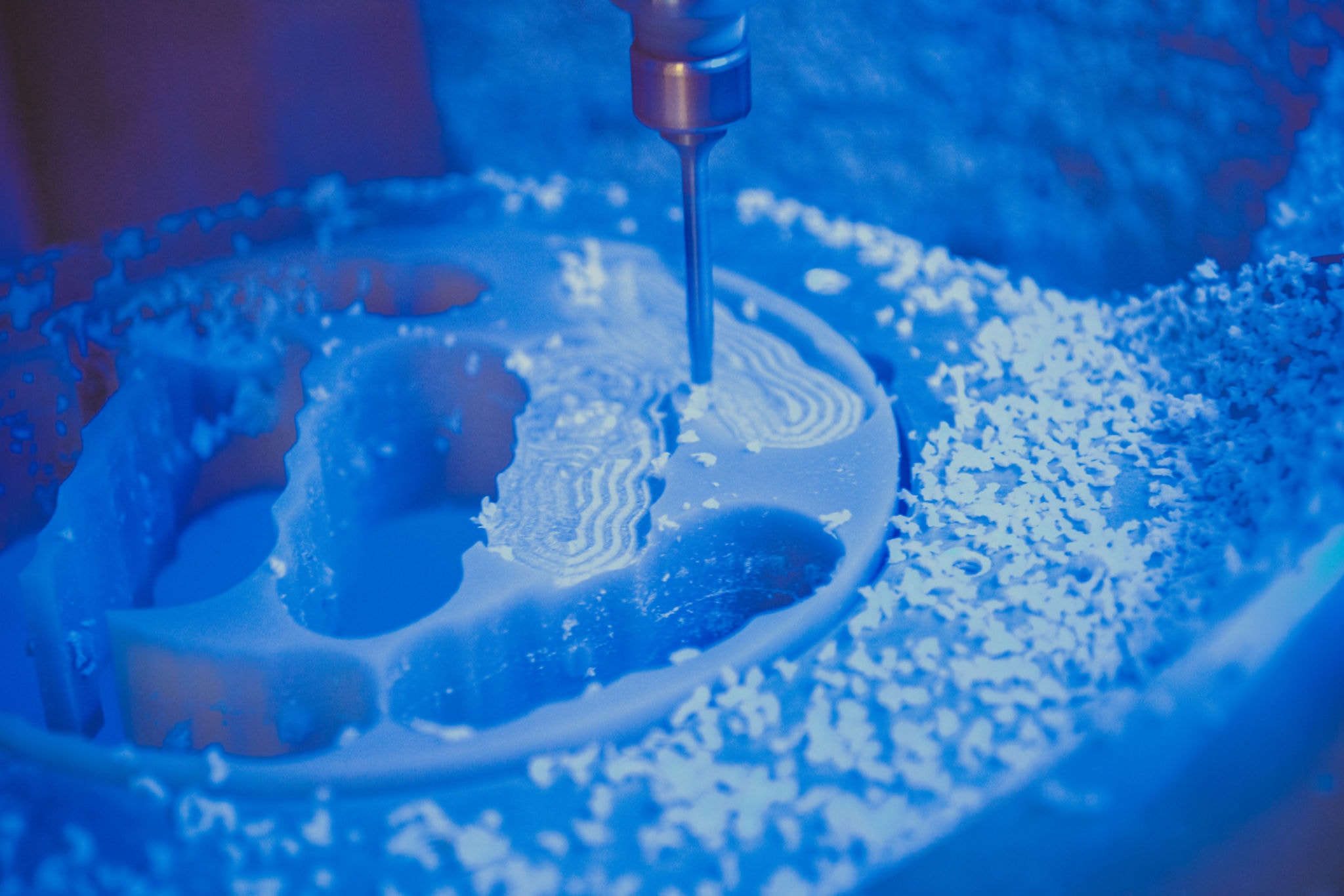 Dental milling machine carving a tooth restoration